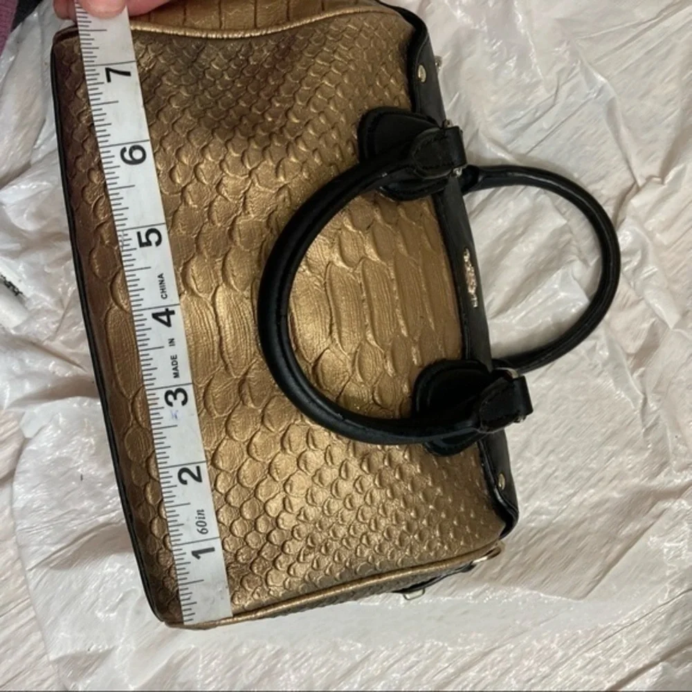 Coach gold embossed leather mini barrel bag
